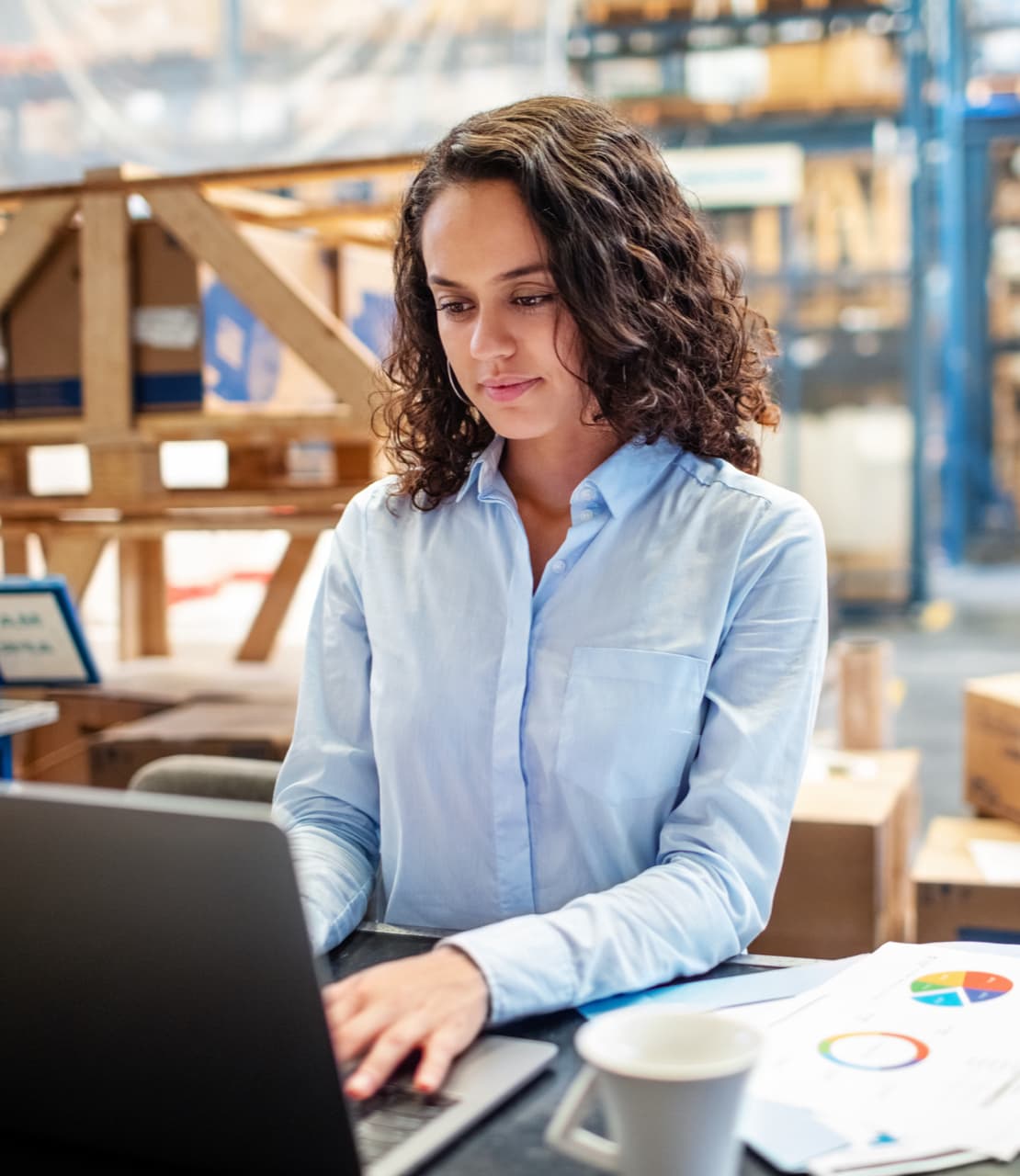 Staff member reviewing shipment paperwork